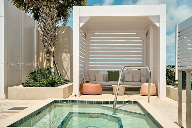 view of swimming pool with an in ground hot tub and a patio area