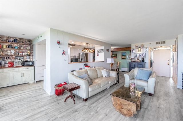 living room with light hardwood / wood-style flooring