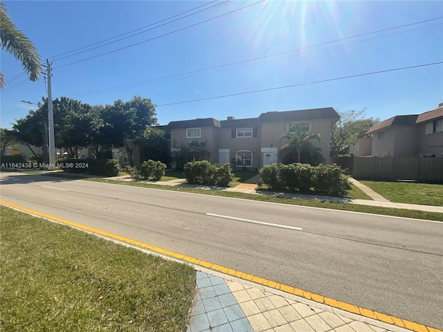 view of street featuring sidewalks and a residential view