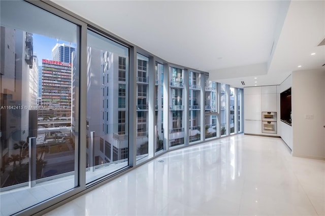 interior space featuring a wall of windows