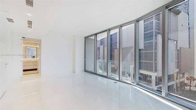 empty room with tile patterned floors