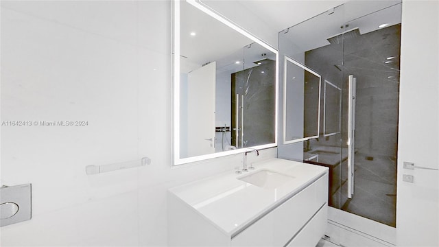 bathroom with vanity and walk in shower