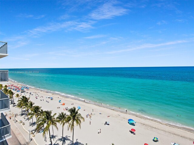 property view of water featuring a beach view