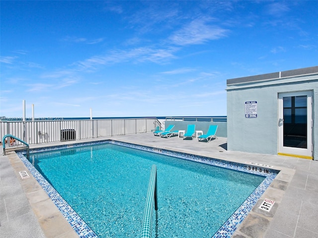 view of swimming pool with a patio