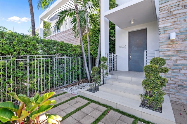 entrance to property featuring a balcony