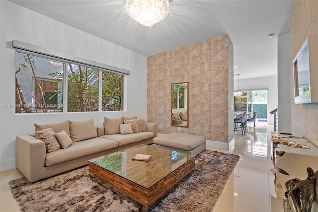 tiled living room featuring a chandelier