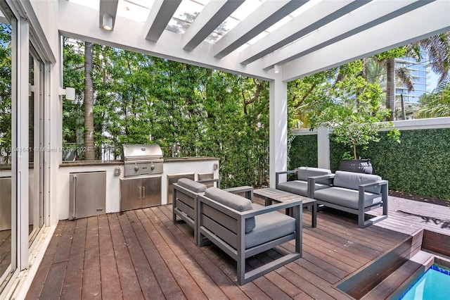 wooden terrace featuring area for grilling