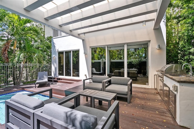 view of patio featuring grilling area, an outdoor hangout area, a pergola, and a pool side deck