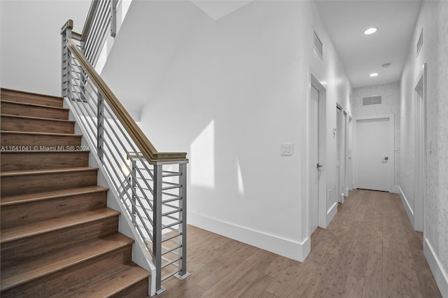 stairway with wood-type flooring