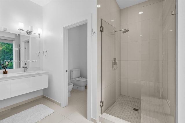 bathroom featuring toilet, vanity, tile patterned floors, a bidet, and walk in shower