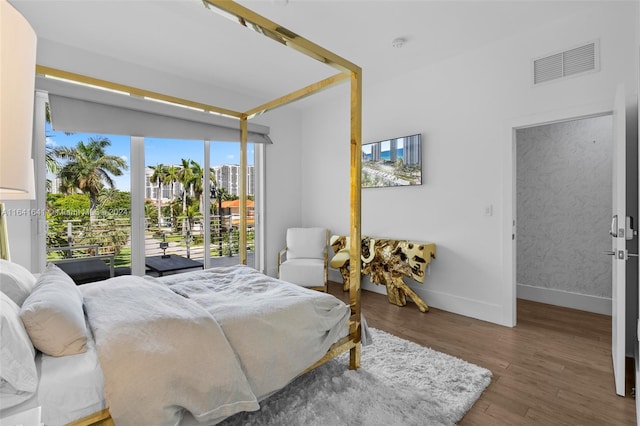 bedroom featuring hardwood / wood-style floors