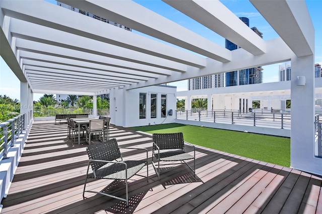 wooden deck featuring a pergola and an outdoor hangout area