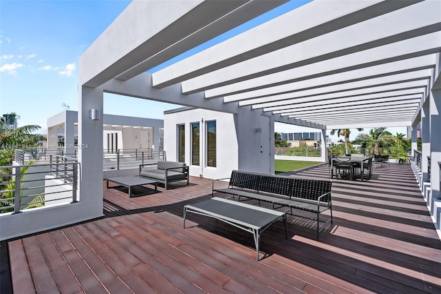 wooden terrace featuring an outdoor hangout area and a pergola