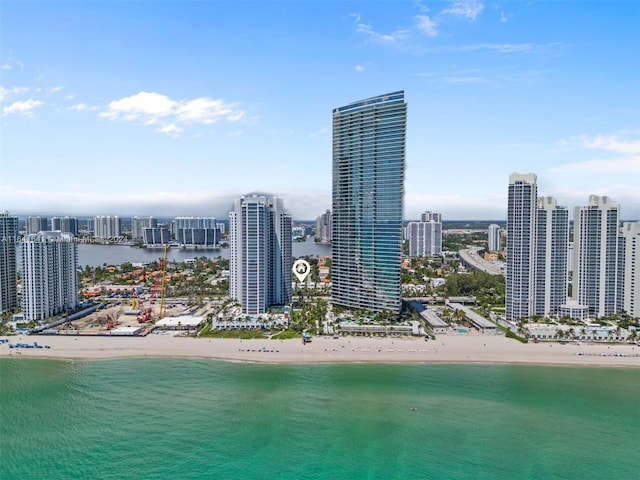 property's view of city featuring a beach view and a water view