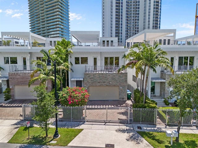 view of front facade featuring a balcony and a garage