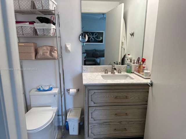 bathroom featuring vanity and toilet