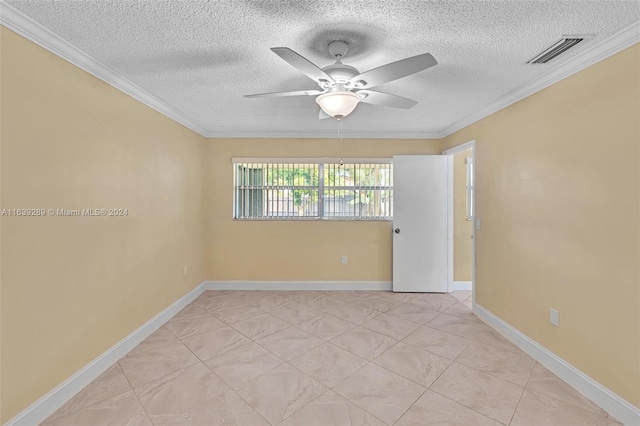 tiled empty room with ceiling fan, crown molding, and a textured ceiling