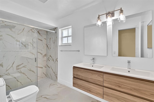 bathroom with a shower with shower door, toilet, double vanity, and tile patterned flooring