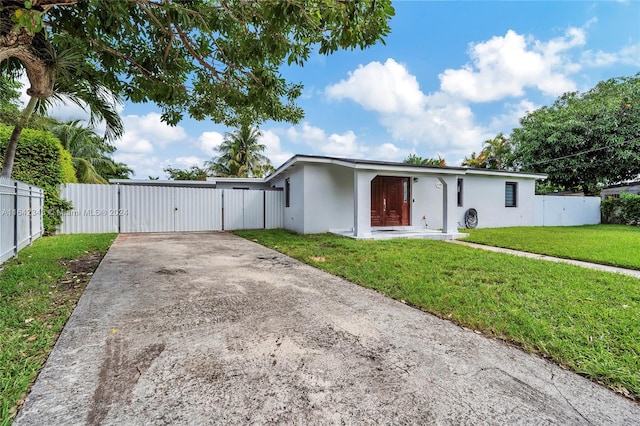 ranch-style house with a front yard