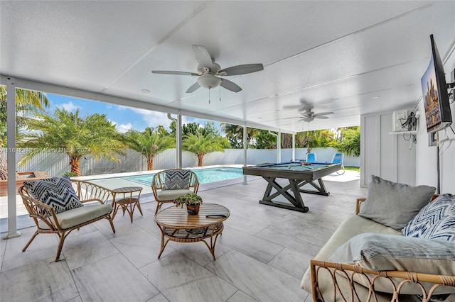 view of patio with ceiling fan, a fenced in pool, and an outdoor living space