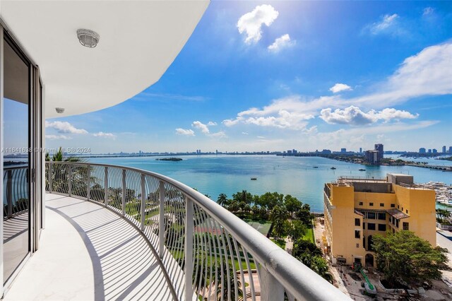 balcony featuring a water view