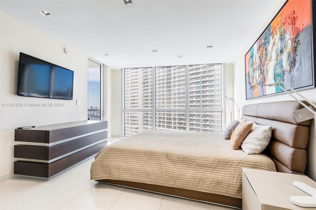 tiled bedroom with expansive windows