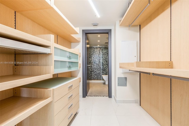 spacious closet featuring light tile patterned flooring