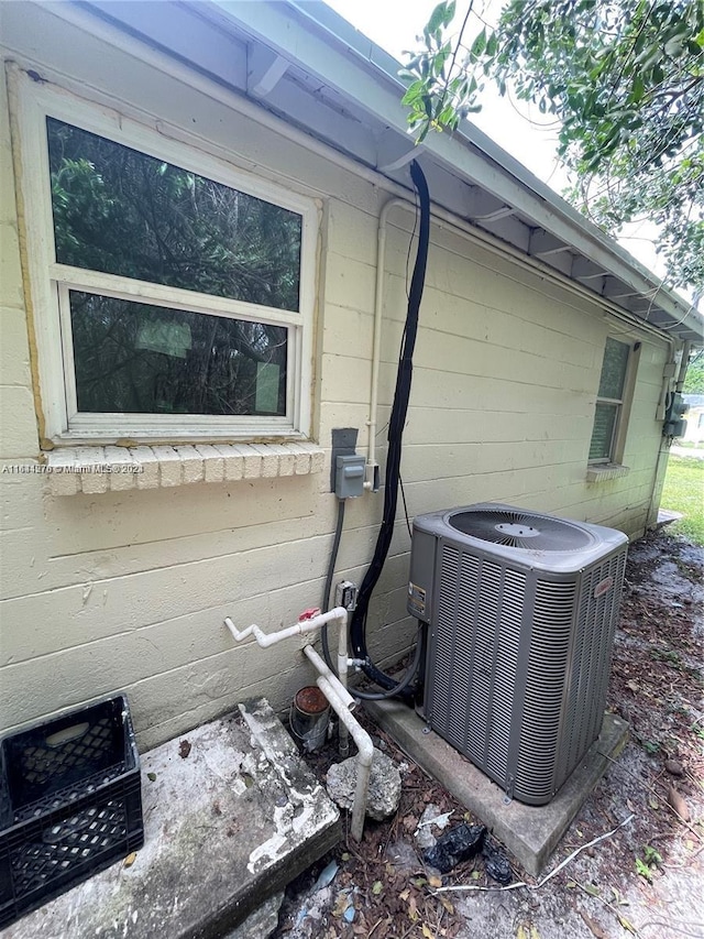 view of side of property with central AC