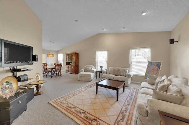 living room featuring a textured ceiling, light colored carpet, and lofted ceiling