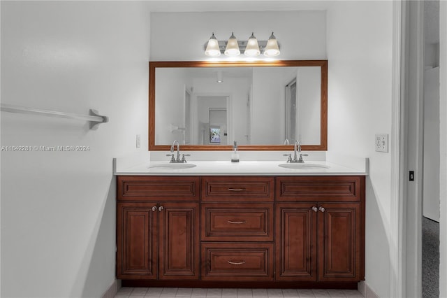 bathroom with tile patterned flooring and vanity