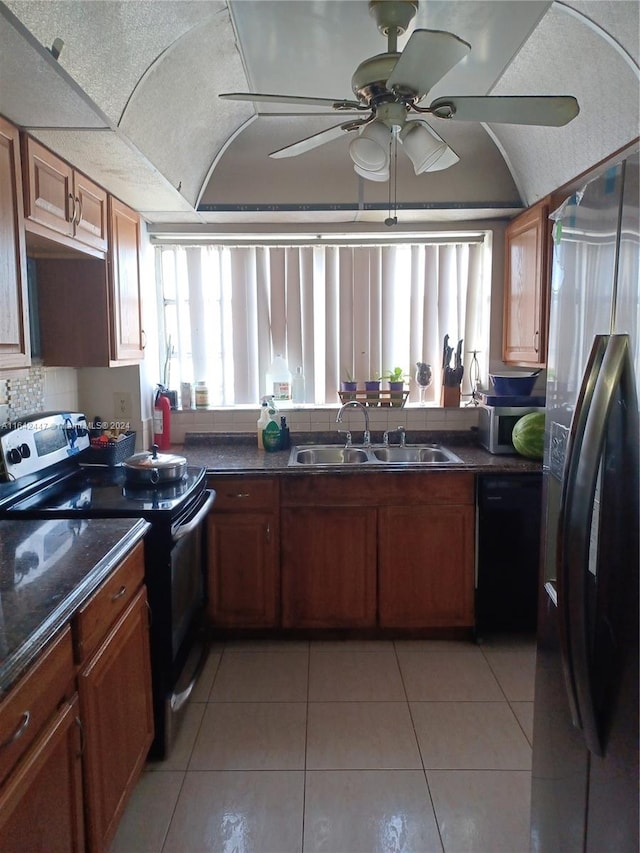 kitchen featuring sink, ceiling fan, light tile patterned flooring, and black appliances