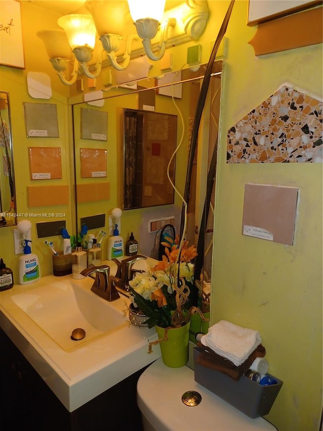 bathroom with sink and an inviting chandelier