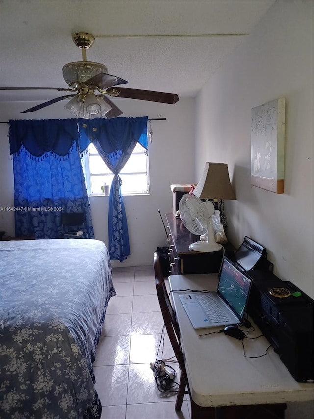 bedroom with ceiling fan and light tile patterned flooring