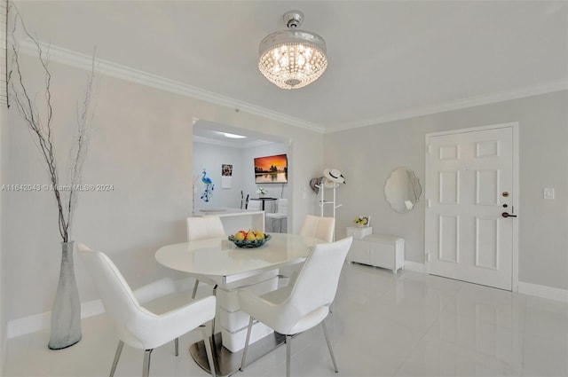 tiled dining room featuring a chandelier and ornamental molding