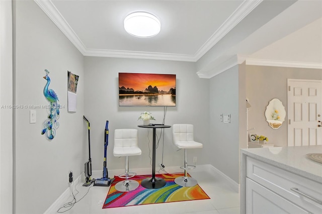 bathroom with tile patterned flooring, ornamental molding, and vanity