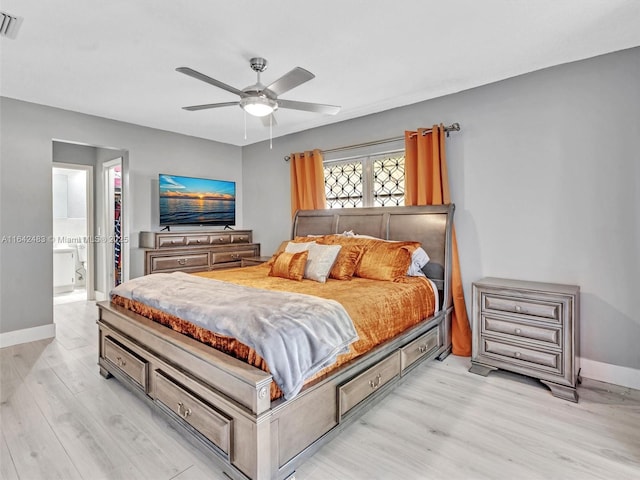 bedroom featuring ceiling fan, connected bathroom, and light wood-type flooring