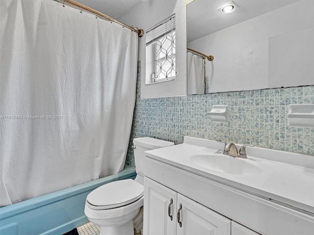 full bathroom featuring toilet, shower / bath combo with shower curtain, vanity, and tile walls