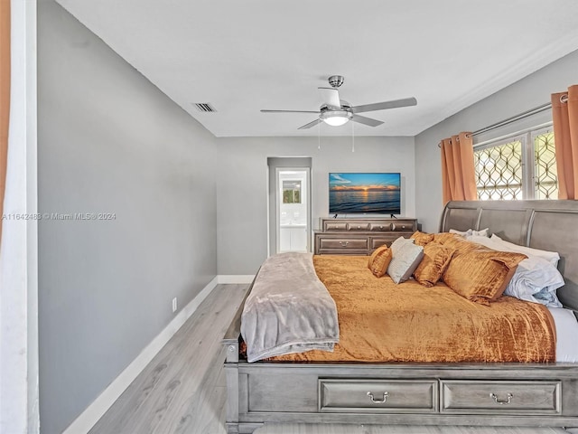 bedroom with light wood-type flooring and ceiling fan