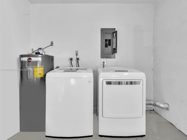 clothes washing area featuring washing machine and dryer, water heater, and electric panel