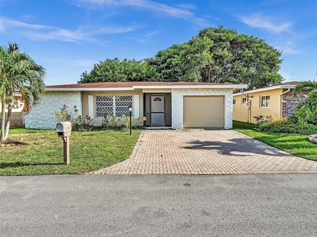 ranch-style home with a garage and a front yard