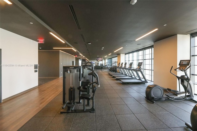 gym with dark hardwood / wood-style flooring