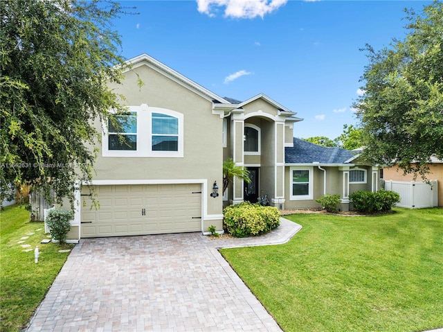 view of front of home featuring a garage and a front lawn