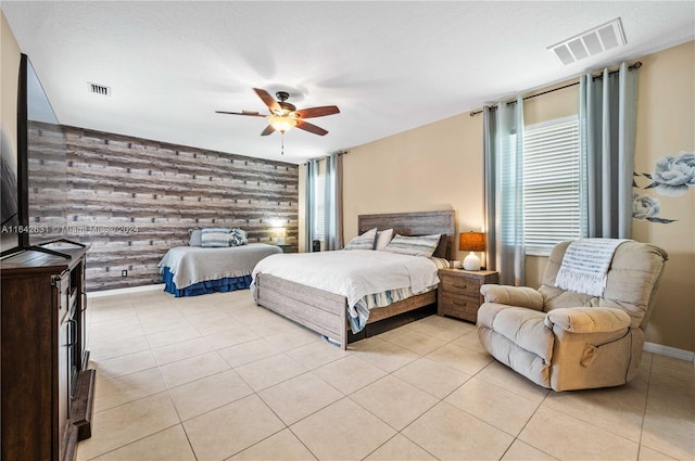 tiled bedroom with multiple windows and ceiling fan