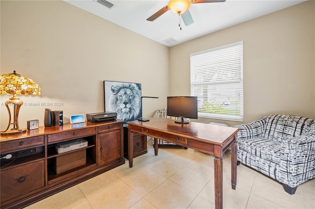 office featuring light tile patterned floors and ceiling fan