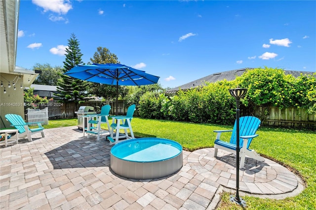 view of patio / terrace with a grill