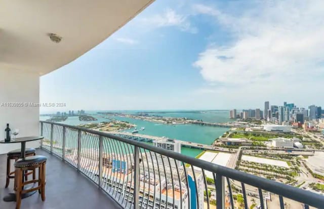 balcony featuring a water view