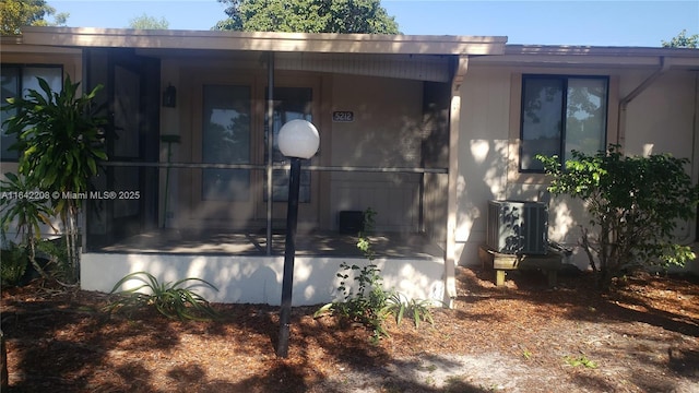 view of side of property with central AC unit