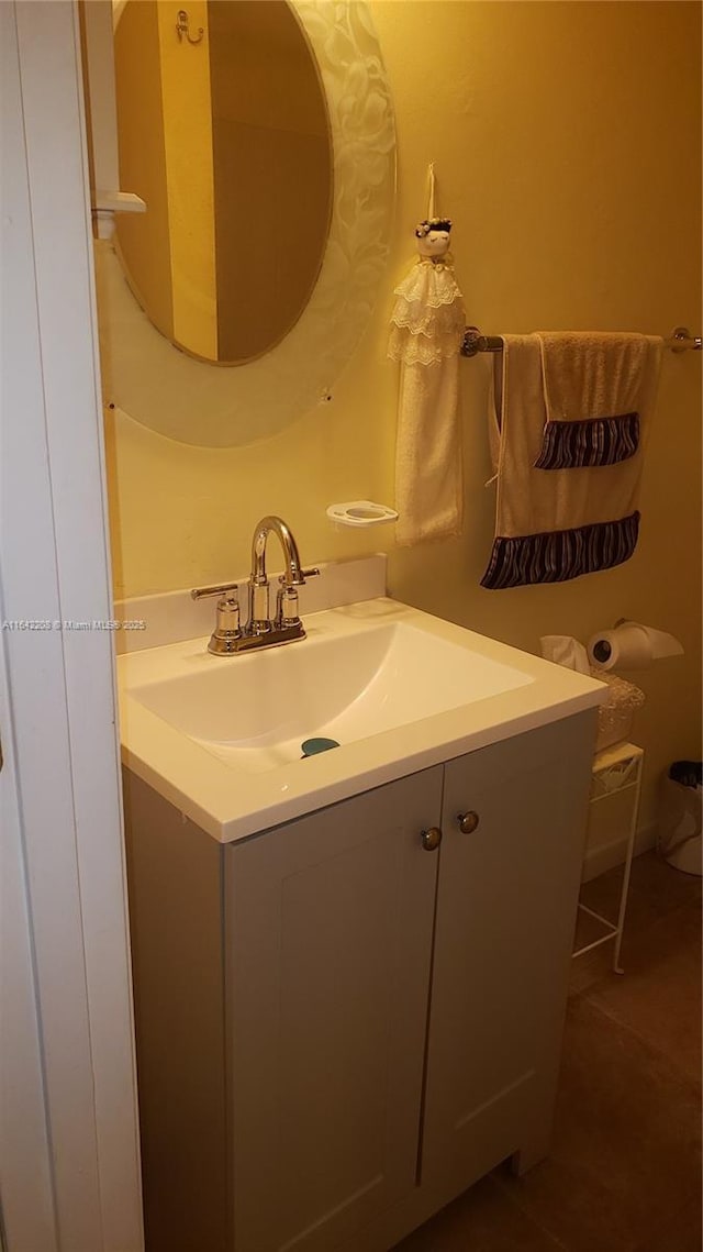 bathroom with tile patterned flooring and vanity