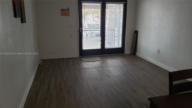 spare room featuring dark hardwood / wood-style floors