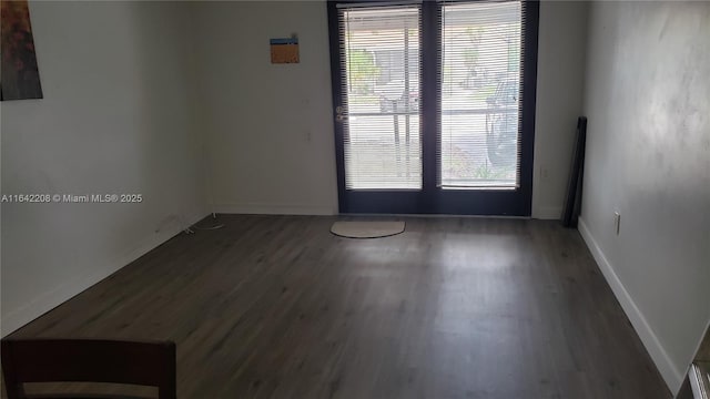 5212 Treetops Dr Unit B-4, Naples, FL 34113 - unfurnished room featuring wood finished floors, plenty of natural light, and french doors